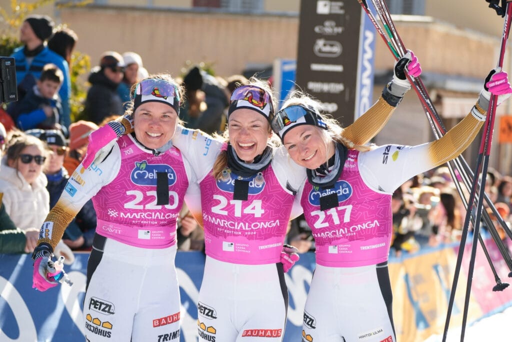 Team Eksjöhus: Sofie Elebro, Magni Smedås, and Kati Roivas celebrate after Marcialonga Season XV